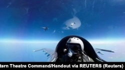 A pilot is photographed operating an aircraft of the Air Force under the Eastern Theatre Command of China's People's Liberation Army
