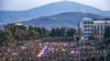 Nagorno-Karabakh - Protesters hold a giant Armenian flag as they attend a rally in Stepanakert on December 25, 2022.