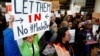 Dulles Dispatch: Protesters Greet Travelers With Smiles As Confusion Persists Over U.S. Travel Ban