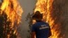 Armenia - A Ministry for Emergency Situations worker battles a wildfire in the Vayots Dzor province, 11Aug2017.
