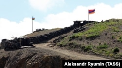 Azerbaijani (L) and Armenian army posts by the Sotk gold mine in Armenia's Gegharkunik province, June 18, 2021/