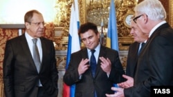 Russian Foreign Minister Segei Lavrov (left to right), Ukrainian Foreign Minister Pavlo Klimkin, French Foreign Minister Jean-Marc Ayrault, and German Foreign Minister Frank-Walter Steinmeier talk before a meeting to discuss the Ukraine crisis in Paris in March.