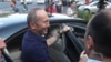 Armenia -- Former President Robert Kocharian talks to reporters outside a prison in Yerevan, June 25, 2019.
