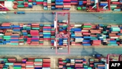 بندر چینگدائو، چین؛ تنش‌های تازه بین دو اقتصاد بزرگ جهان، به نگرانی‌ها دامن زده‌است